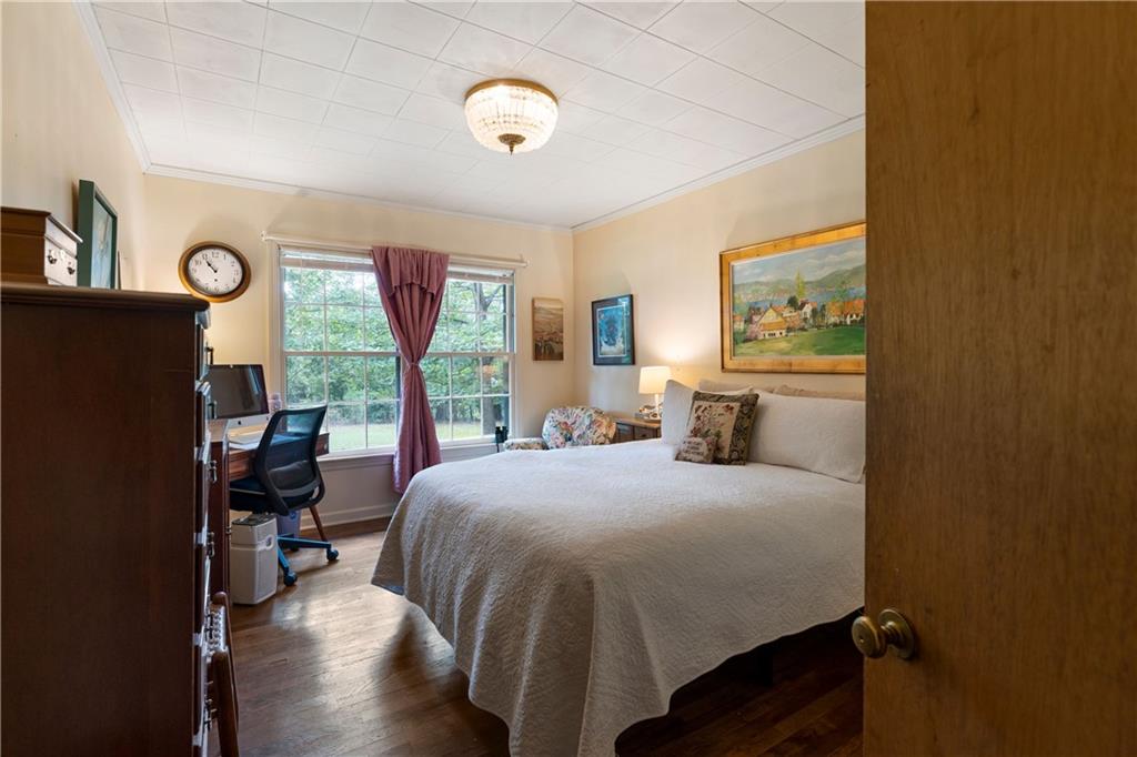 79 Floyd Road Southwest Cartersville, GA 30120 - Photo 21 of 50 a bedroom with a bed and a window