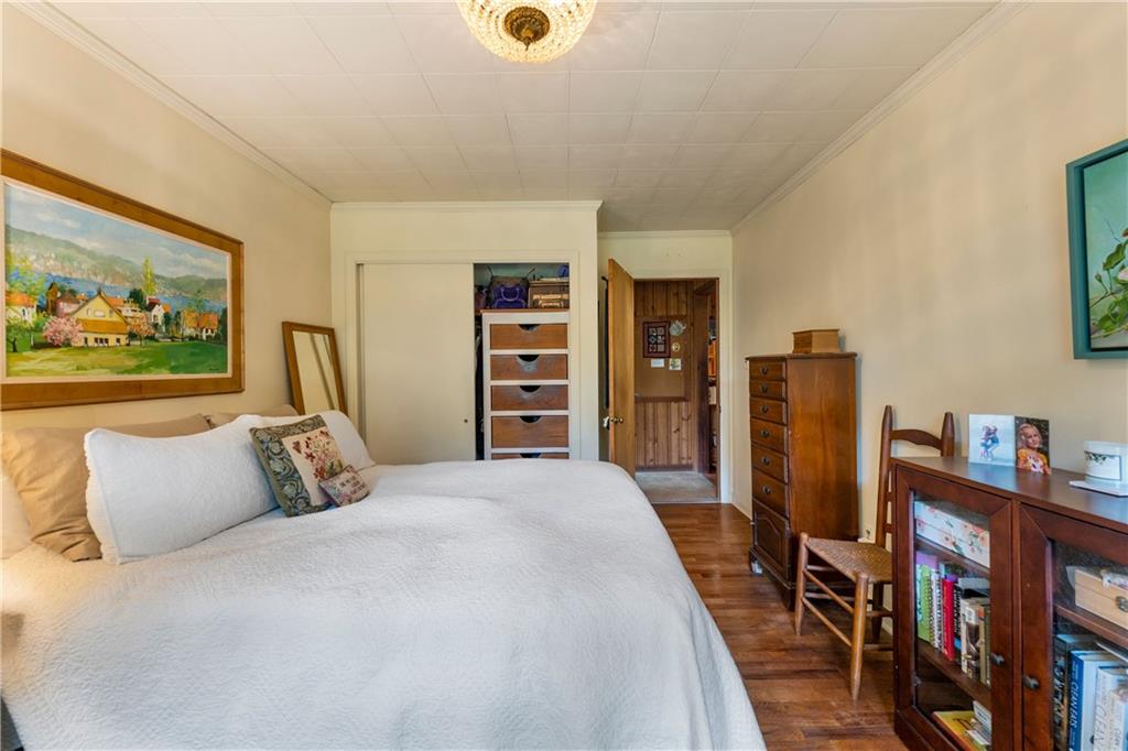 79 Floyd Road Southwest Cartersville, GA 30120 - Photo 22 of 50 a bedroom with furniture and a large window