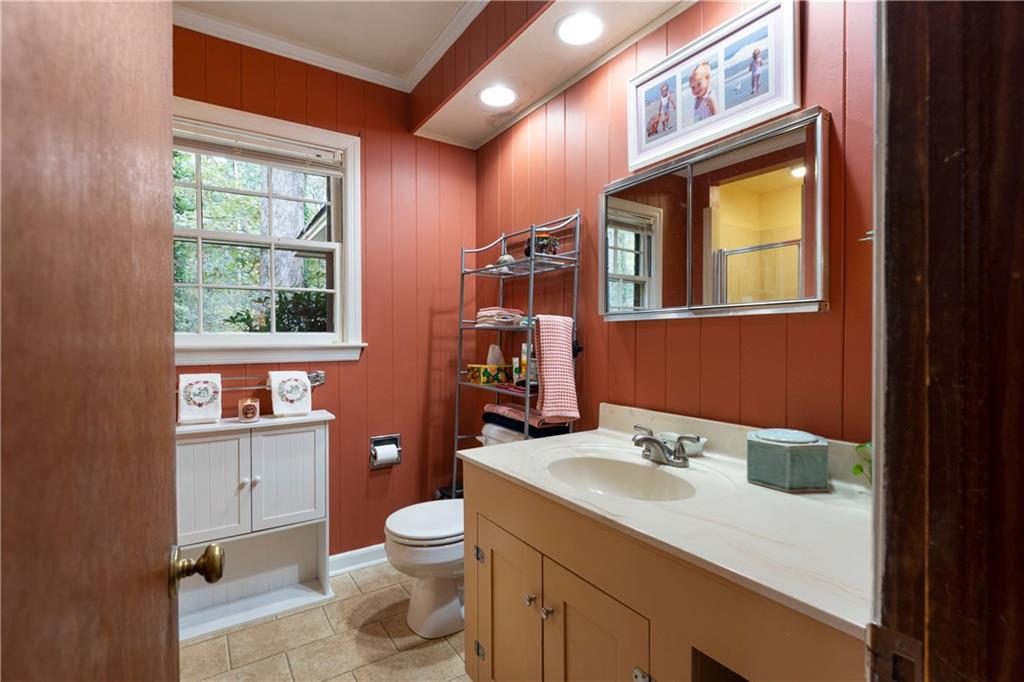 79 Floyd Road Southwest Cartersville, GA 30120 - Photo 23 of 50 a bathroom with a sink a toilet and mirror
