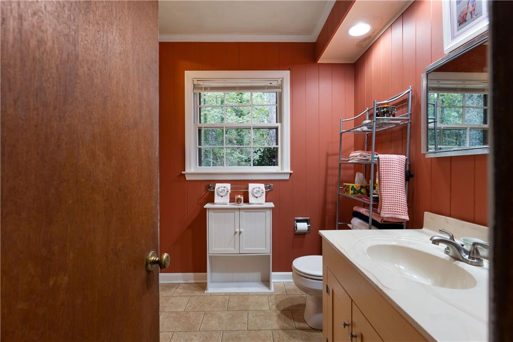79 Floyd Road Southwest Cartersville, GA 30120 - Photo 24 of 50 a bathroom with a sink toilet and a mirror
