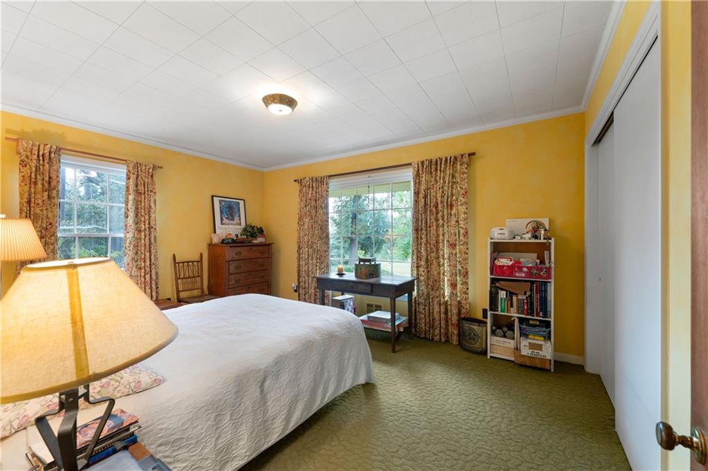 79 Floyd Road Southwest Cartersville, GA 30120 - Photo 26 of 50 a bed sitting in a room next to a window