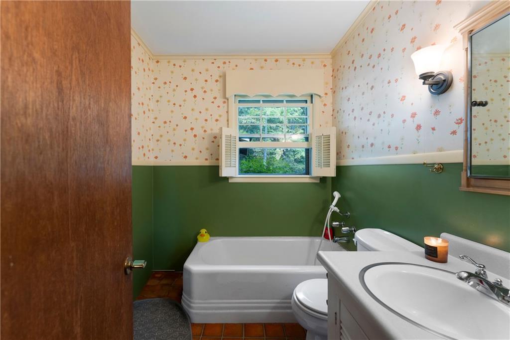 79 Floyd Road Southwest Cartersville, GA 30120 - Photo 27 of 50 a bathroom with a sink toilet and a mirror