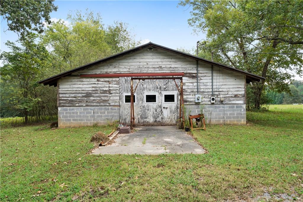 79 Floyd Road Southwest Cartersville, GA 30120 - Photo 33 of 50 a view of a house with a yard