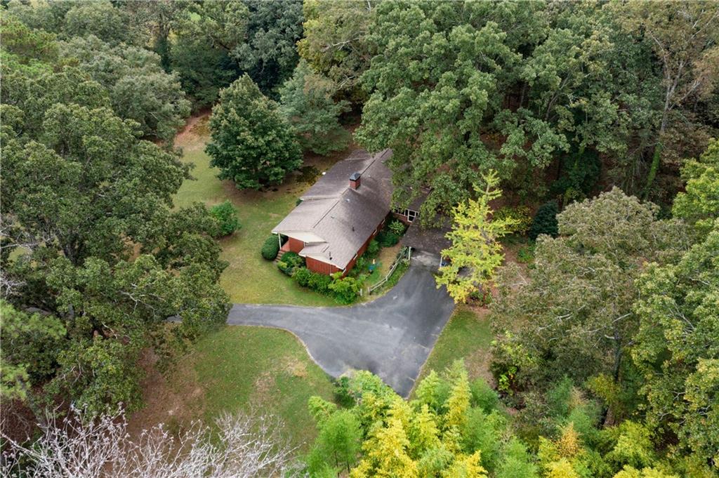 79 Floyd Road Southwest Cartersville, GA 30120 - Photo 35 of 50 an aerial view of a house with a yard and large trees