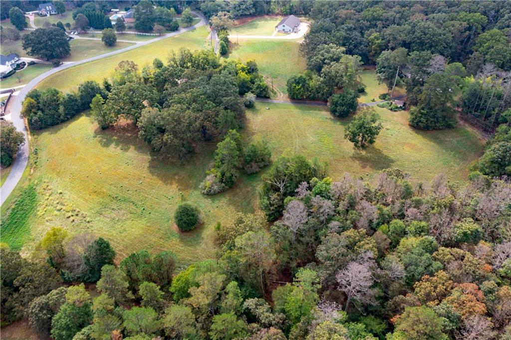 79 Floyd Road Southwest Cartersville, GA 30120 - Photo 42 of 50 an aerial view of residential houses with outdoor space and trees all around