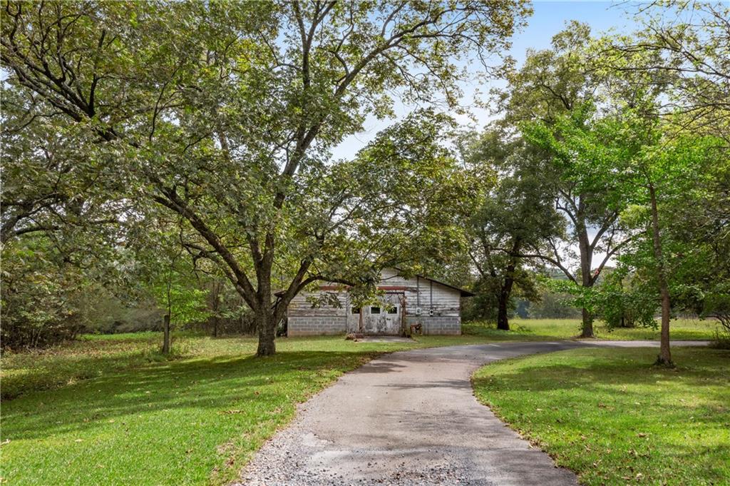 79 Floyd Road Southwest Cartersville, GA 30120 - Photo 48 of 50 a front view of a house with a yard