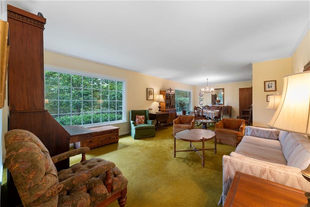 79 Floyd Road Southwest Cartersville, GA 30120 - Photo 7 of 50 a living room with furniture and a large window