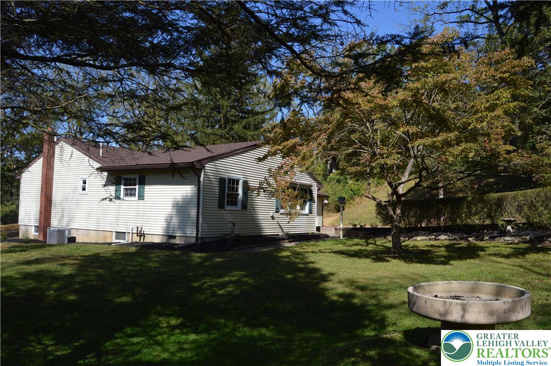 930 Morvale Road Easton, PA 18042 - Photo 4 of 36 a front view of a house with garden