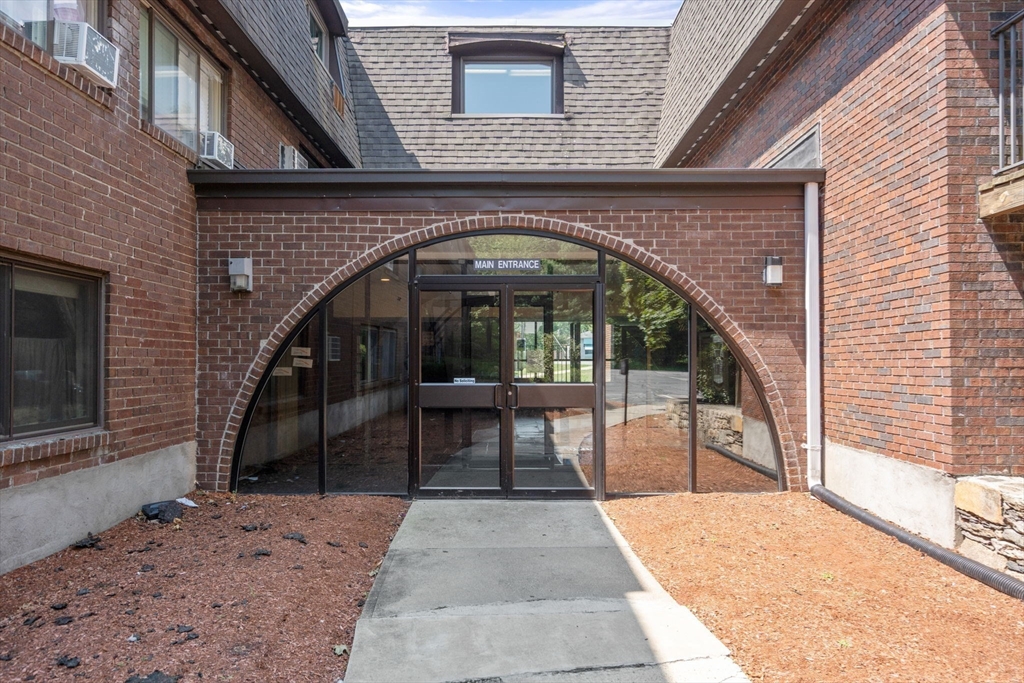 688 Boston Post Road East, Unit 304 Marlborough, MA 01752 - Photo 13 of 20 a view of entryway with garden
