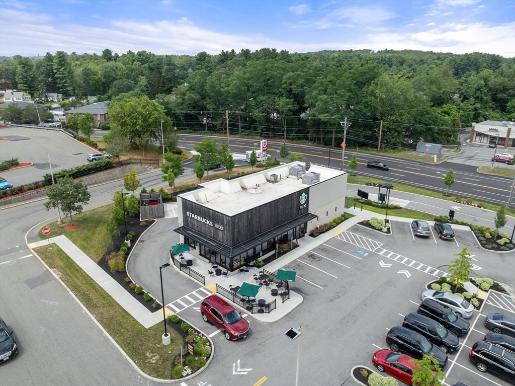 688 Boston Post Road East, Unit 304 Marlborough, MA 01752 - Photo 19 of 20 a view of a chairs and table in a patio