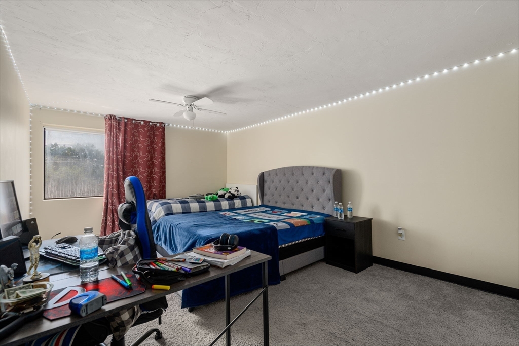 688 Boston Post Road East, Unit 304 Marlborough, MA 01752 - Photo 7 of 20 a workspace with furniture and wooden floor