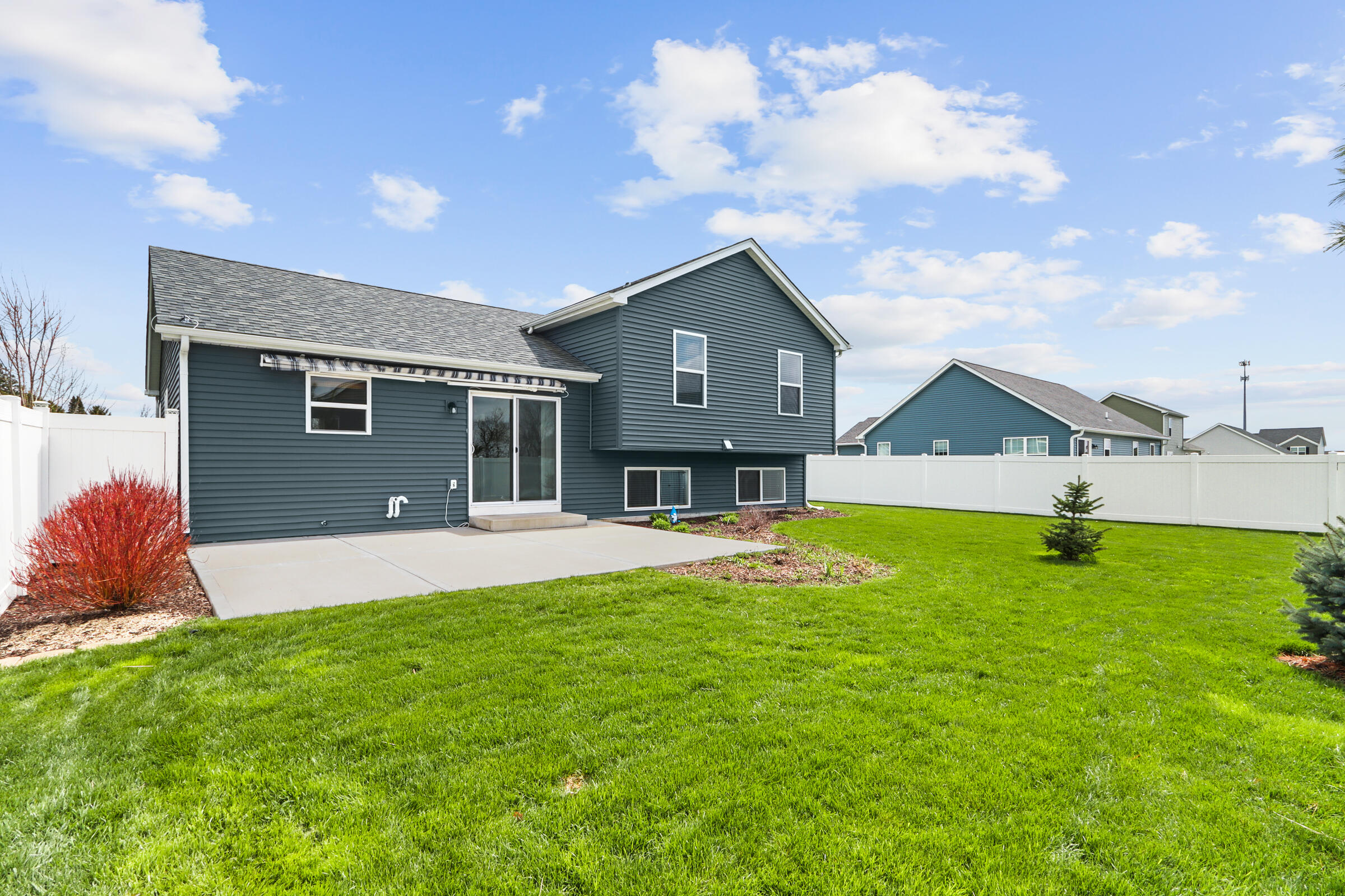 123 Spring Drive Walworth, WI 53184 - Photo 4 of 34 retractable awning over patio