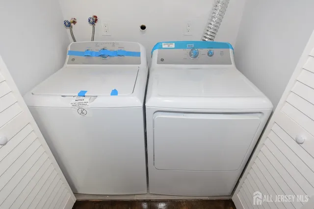 a utility room with dryer and washer