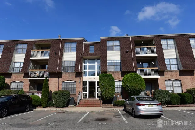 a car parked in front of a brick house