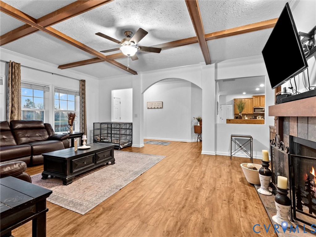 10885 Zilles Road Wilsons, VA 23894 - Photo 11 of 44 a living room with furniture a flat screen tv and a table
