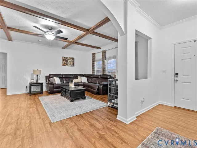 a view of a livingroom with furniture and a flat screen tv