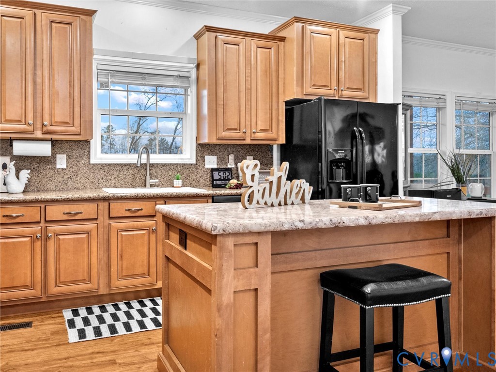 10885 Zilles Road Wilsons, VA 23894 - Photo 16 of 44 a kitchen with stainless steel appliances a sink and a refrigerator