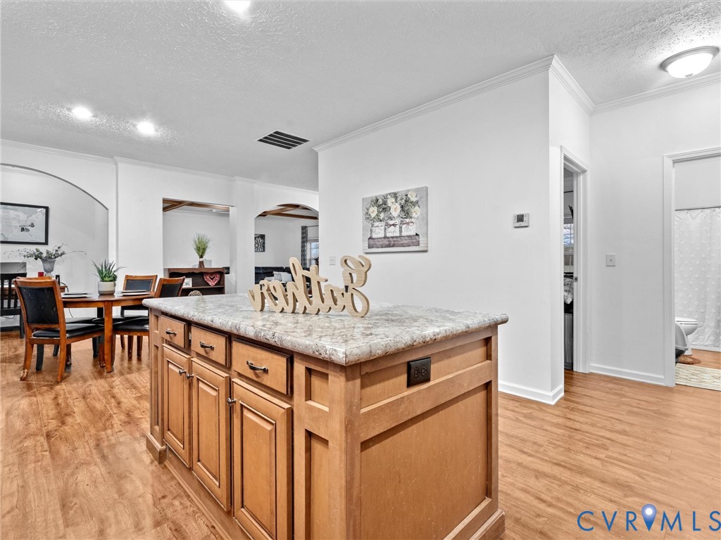 10885 Zilles Road Wilsons, VA 23894 - Photo 18 of 44 a living room with stainless steel appliances granite countertop a table chairs and a refrigerator