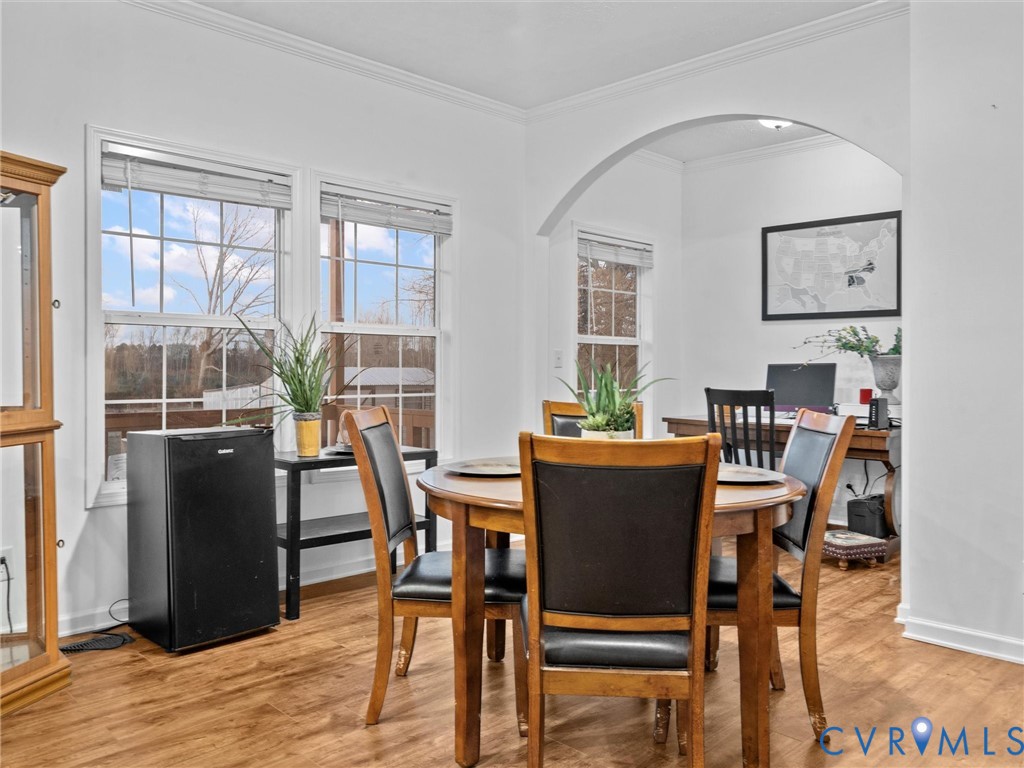 10885 Zilles Road Wilsons, VA 23894 - Photo 21 of 44 a view of a dining room with furniture window and wooden floor
