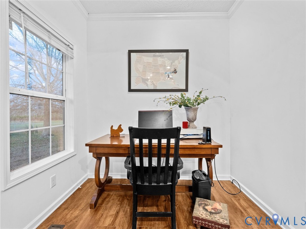10885 Zilles Road Wilsons, VA 23894 - Photo 22 of 44 a view of a dining room with furniture and wooden floor