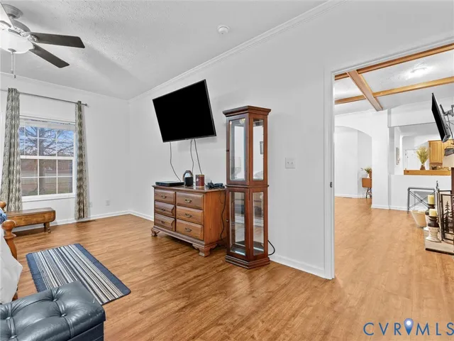 a spacious bathroom with a granite countertop double vanity sink a mirror and a bathtub