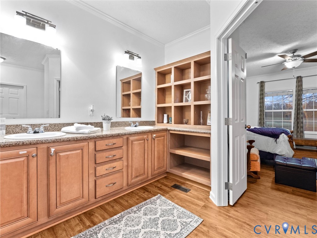 10885 Zilles Road Wilsons, VA 23894 - Photo 34 of 44 a spacious bathroom with double vanity and a shower