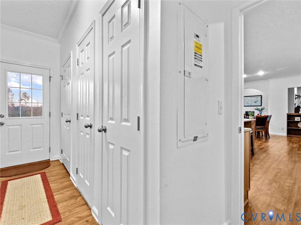 10885 Zilles Road Wilsons, VA 23894 - Photo 36 of 44 a view of a hallway with wooden floor and staircase