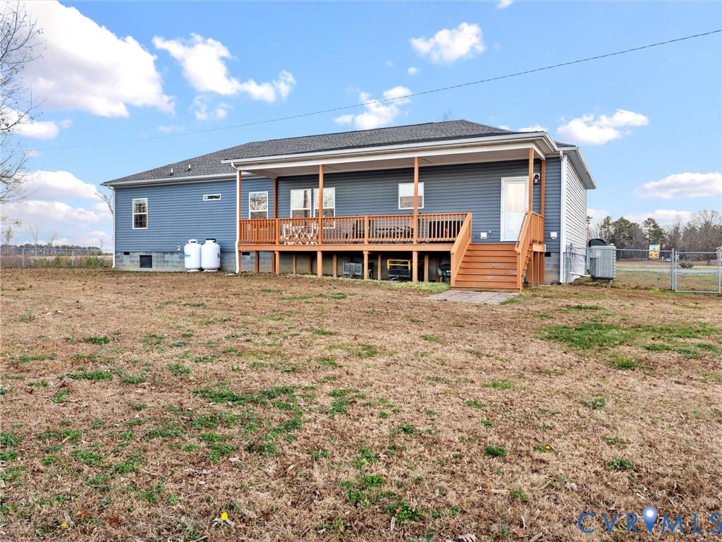 10885 Zilles Road Wilsons, VA 23894 - Photo 5 of 44 a view of a house with a big yard and large tree