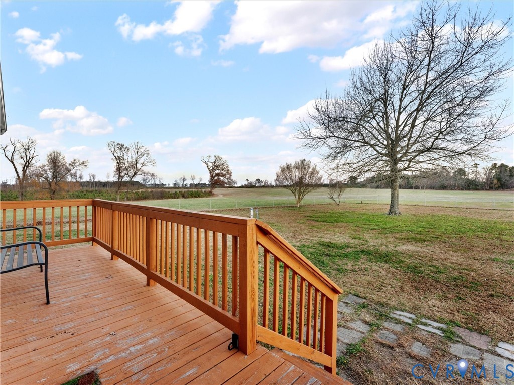 10885 Zilles Road Wilsons, VA 23894 - Photo 6 of 44 a view of couches and table and chairs on the roof deck
