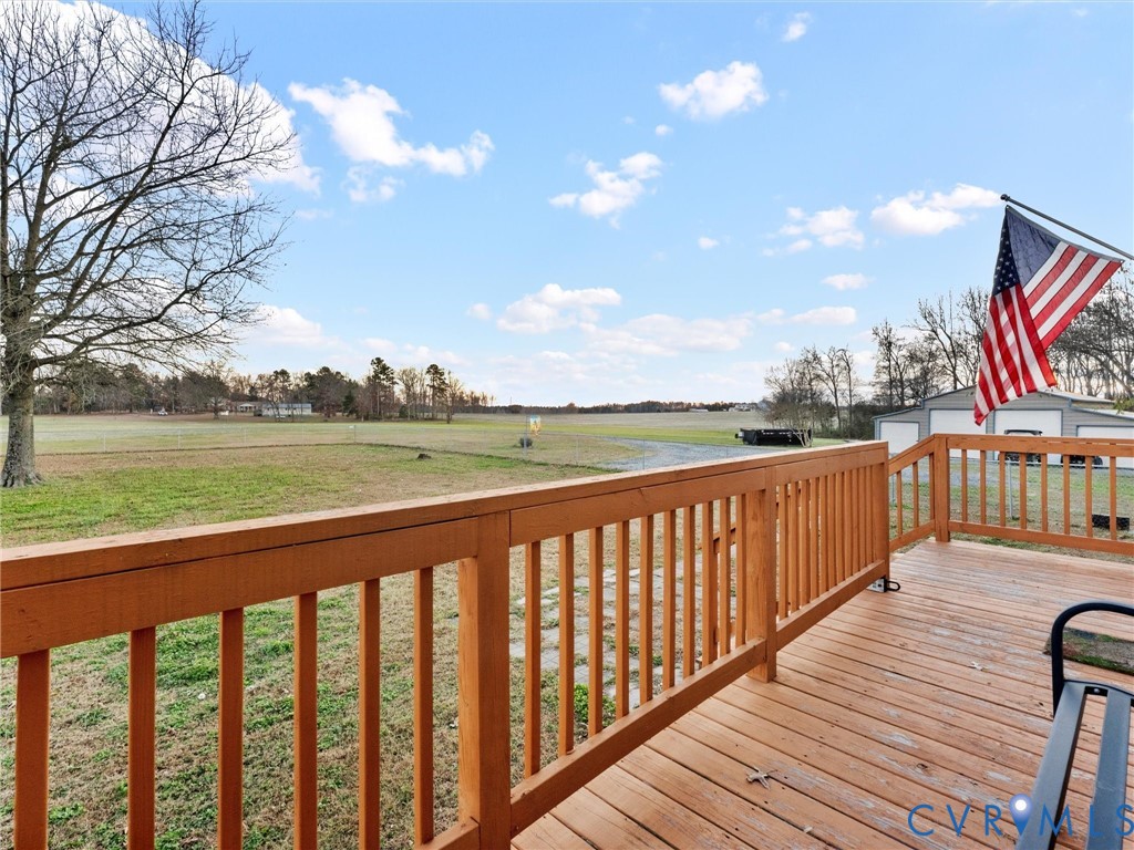 10885 Zilles Road Wilsons, VA 23894 - Photo 7 of 44 a balcony with wooden floor and outdoor space