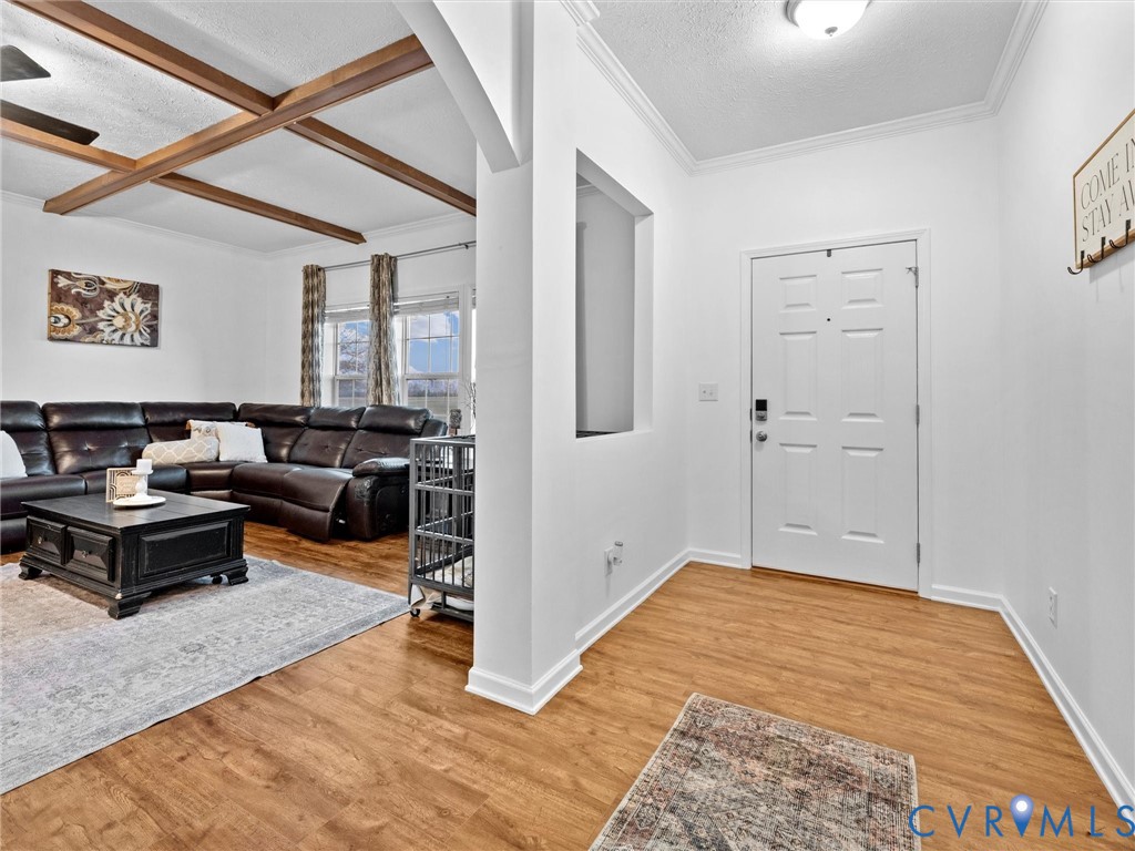 10885 Zilles Road Wilsons, VA 23894 - Photo 8 of 44 a living room with furniture rug and window