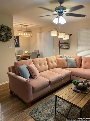 a living room with furniture and a rug