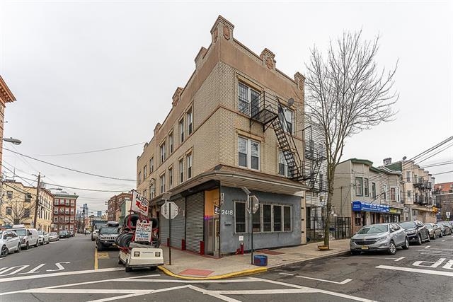 a view of a street with cars