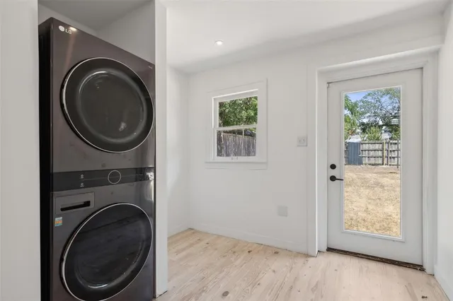 a view of a bedroom with washer and dryer