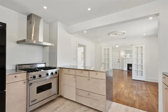 a kitchen with granite countertop a stove and a sink