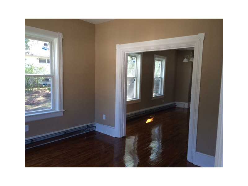 109 Monroe Street Woonsocket, RI 02895 - Photo 4 of 10 Living Room. Living Room and Dining Room with Hardwood Floors