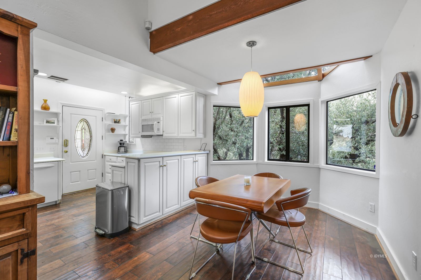55100 Pine Crest Avenue Idyllwild, CA 92549 - Photo 12 of 50 a kitchen with stainless steel appliances granite countertop a stove a sink a refrigerator dining table and chairs