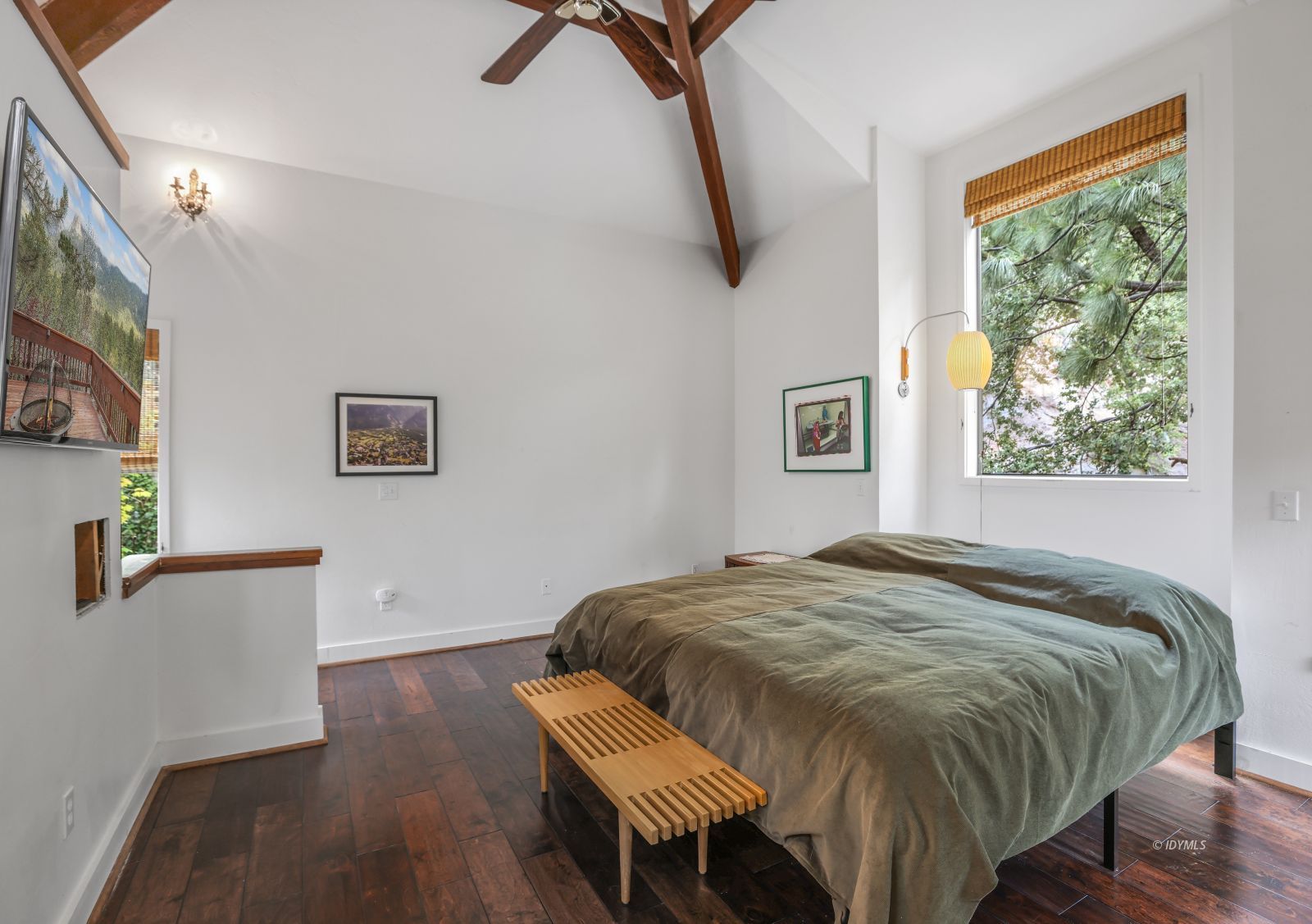 55100 Pine Crest Avenue Idyllwild, CA 92549 - Photo 27 of 50 a bed sitting in a bedroom next to a window