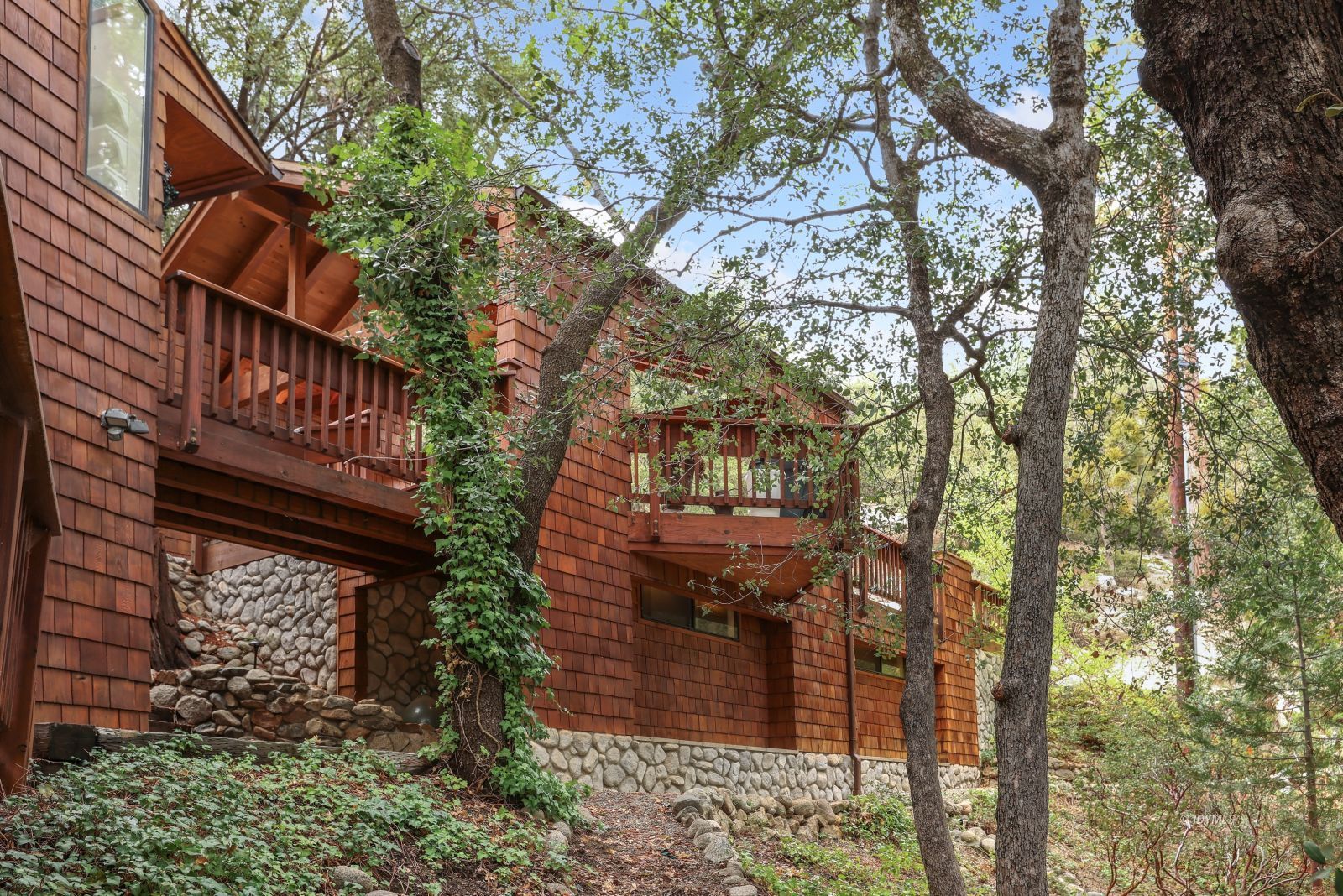 55100 Pine Crest Avenue Idyllwild, CA 92549 - Photo 39 of 50 a view of a house with a tree