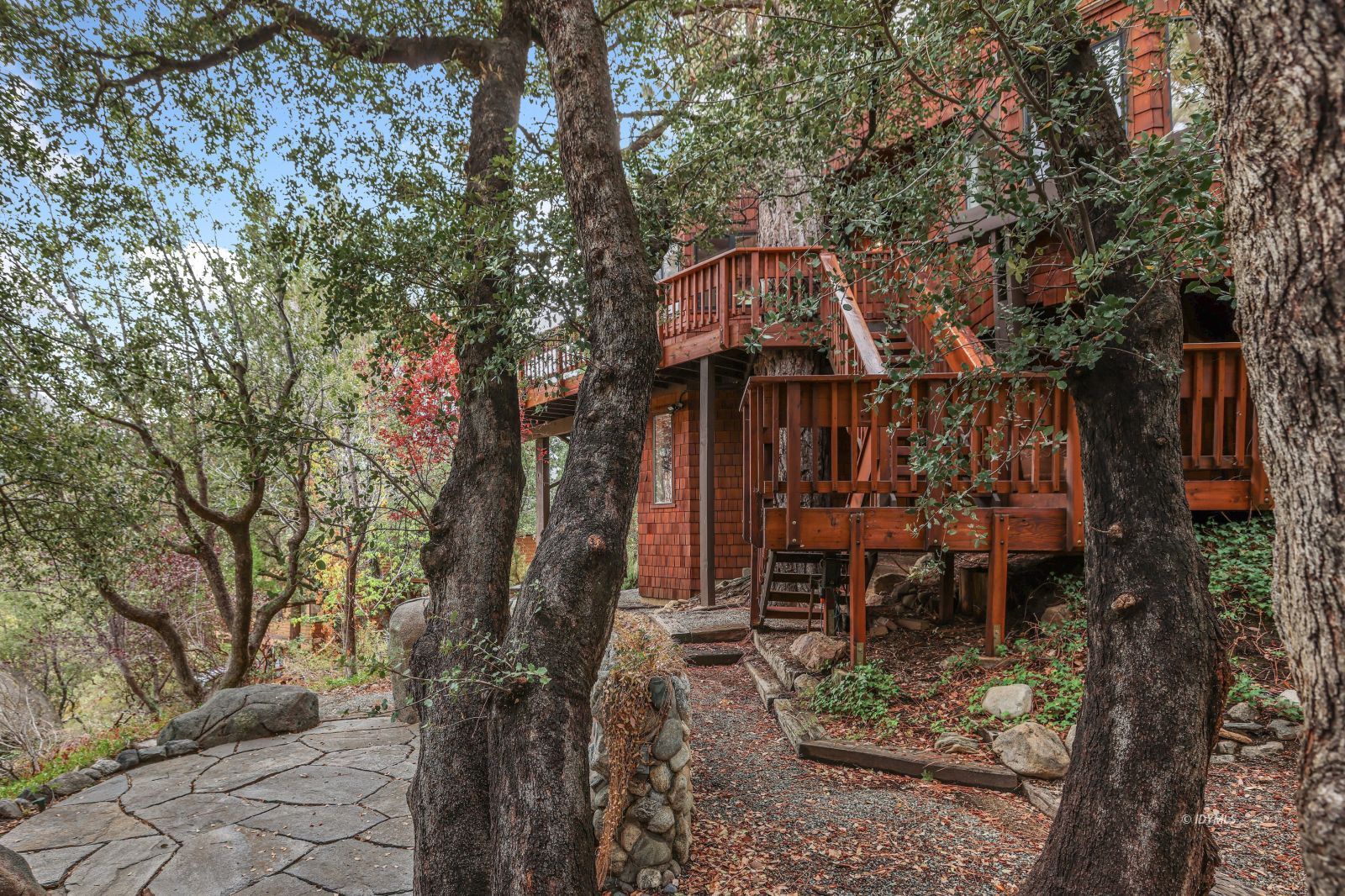 55100 Pine Crest Avenue Idyllwild, CA 92549 - Photo 40 of 50 a backyard of a house with table and chairs