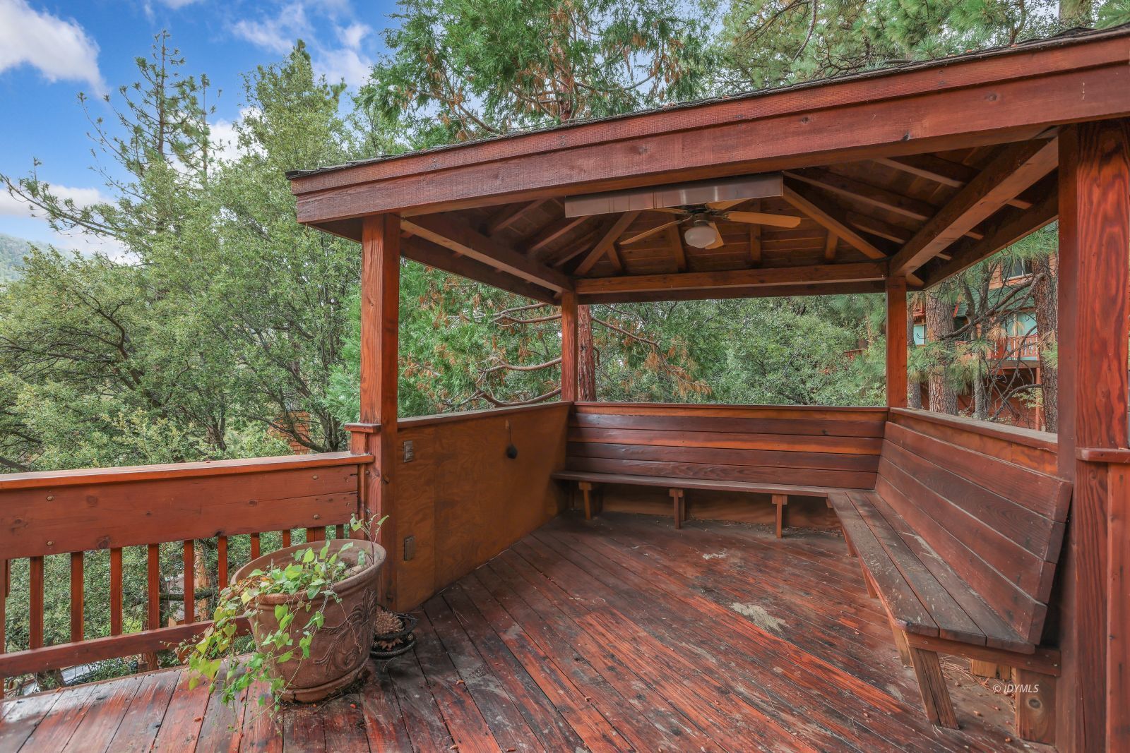55100 Pine Crest Avenue Idyllwild, CA 92549 - Photo 48 of 50 a view of a deck with wooden floor and outdoor seating