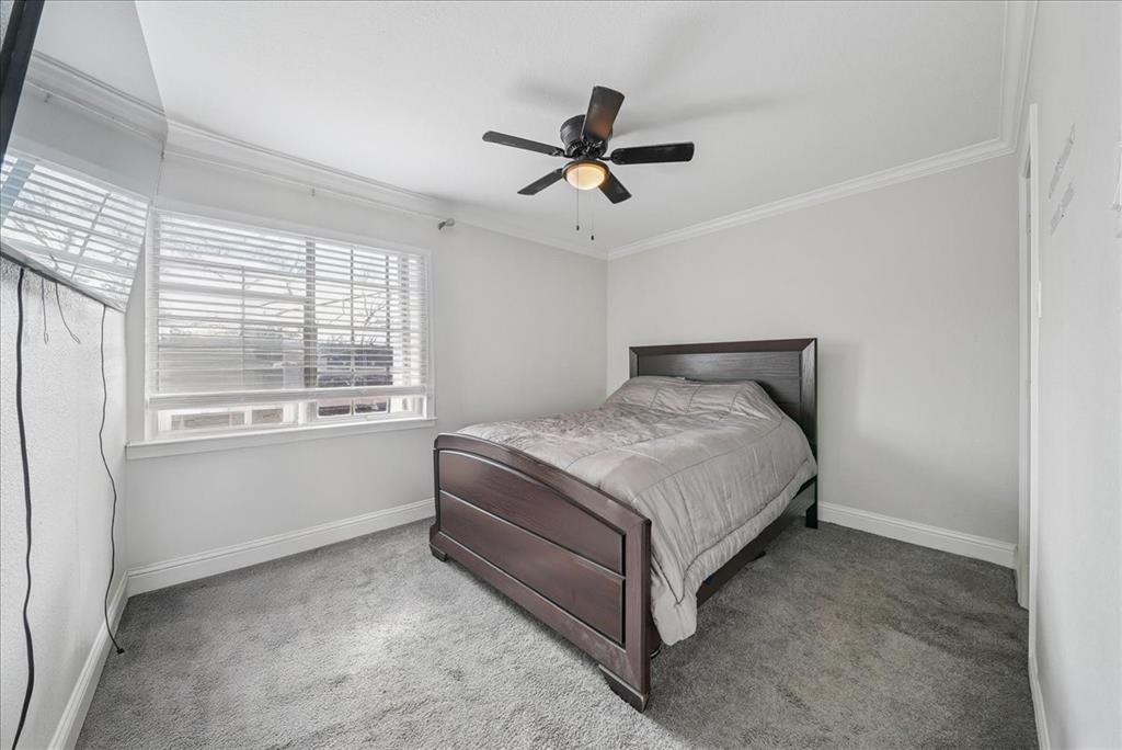 1819 East Grauwyler Road, Unit 178 Irving, TX 75061 - Photo 12 of 22 a bedroom with a bed and window