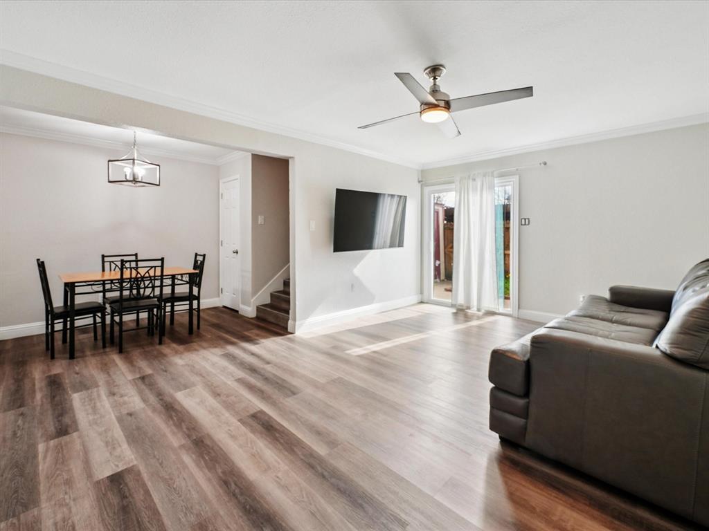 1819 East Grauwyler Road, Unit 178 Irving, TX 75061 - Photo 4 of 22 a living room with furniture and a wooden floor