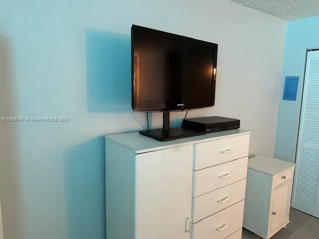 a living room with flat screen tv