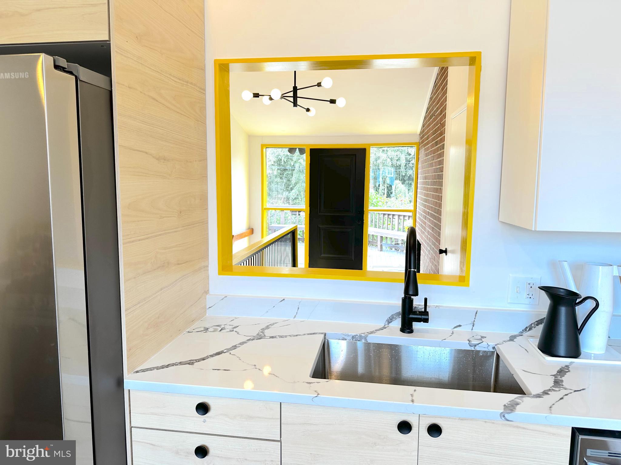 11500 Regnid Drive Silver Spring, MD 20902 - Photo 11 of 50 a kitchen with a sink and a window