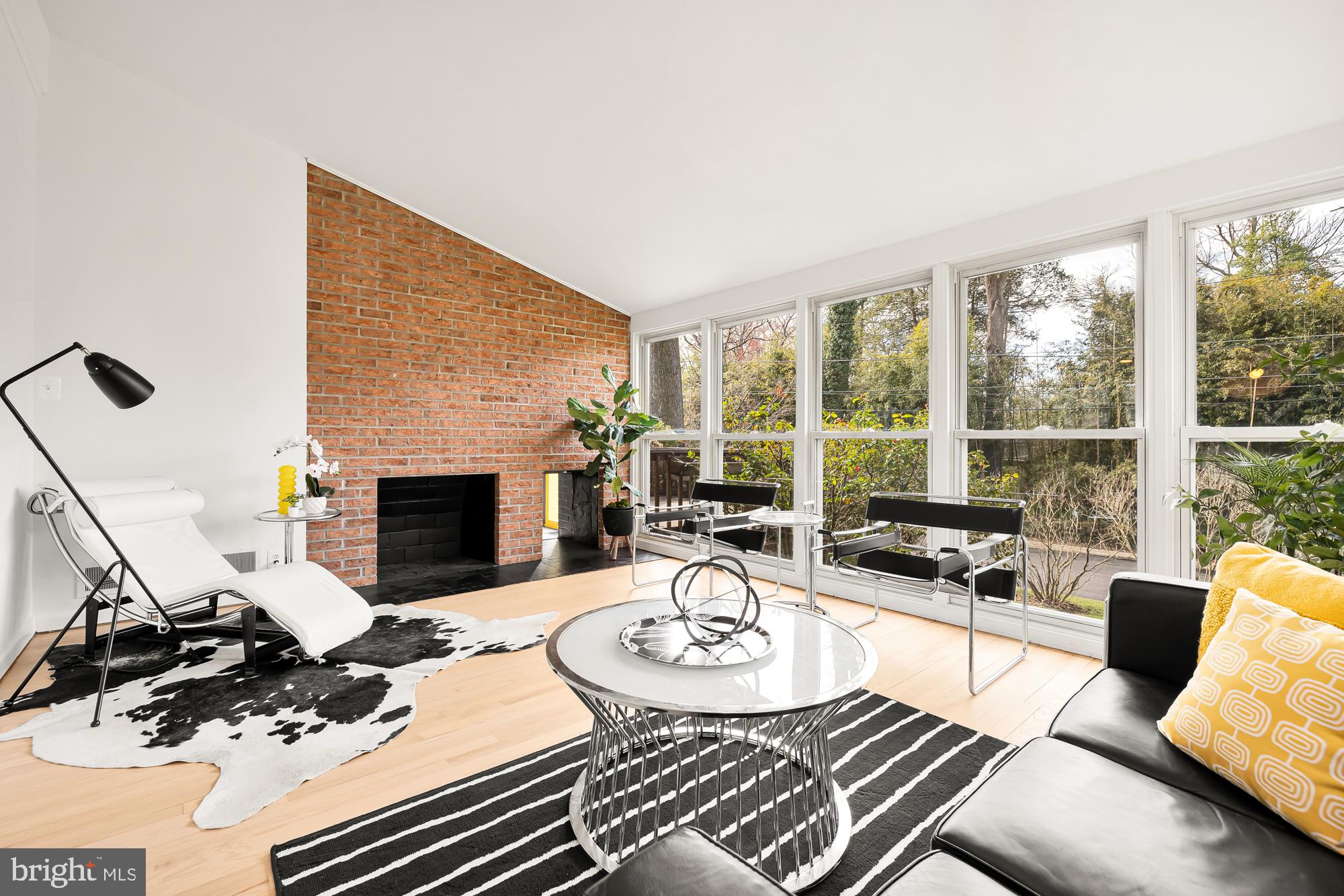 11500 Regnid Drive Silver Spring, MD 20902 - Photo 19 of 50 a living room with furniture and a fireplace