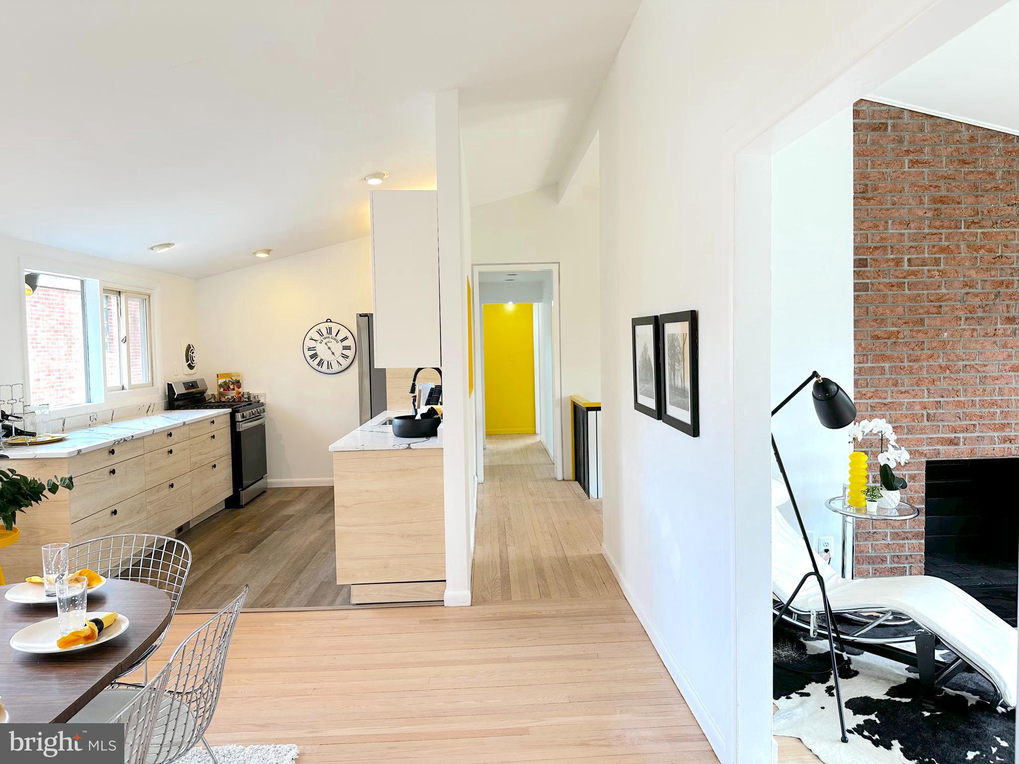 11500 Regnid Drive Silver Spring, MD 20902 - Photo 21 of 50 a living room with furniture and a fireplace
