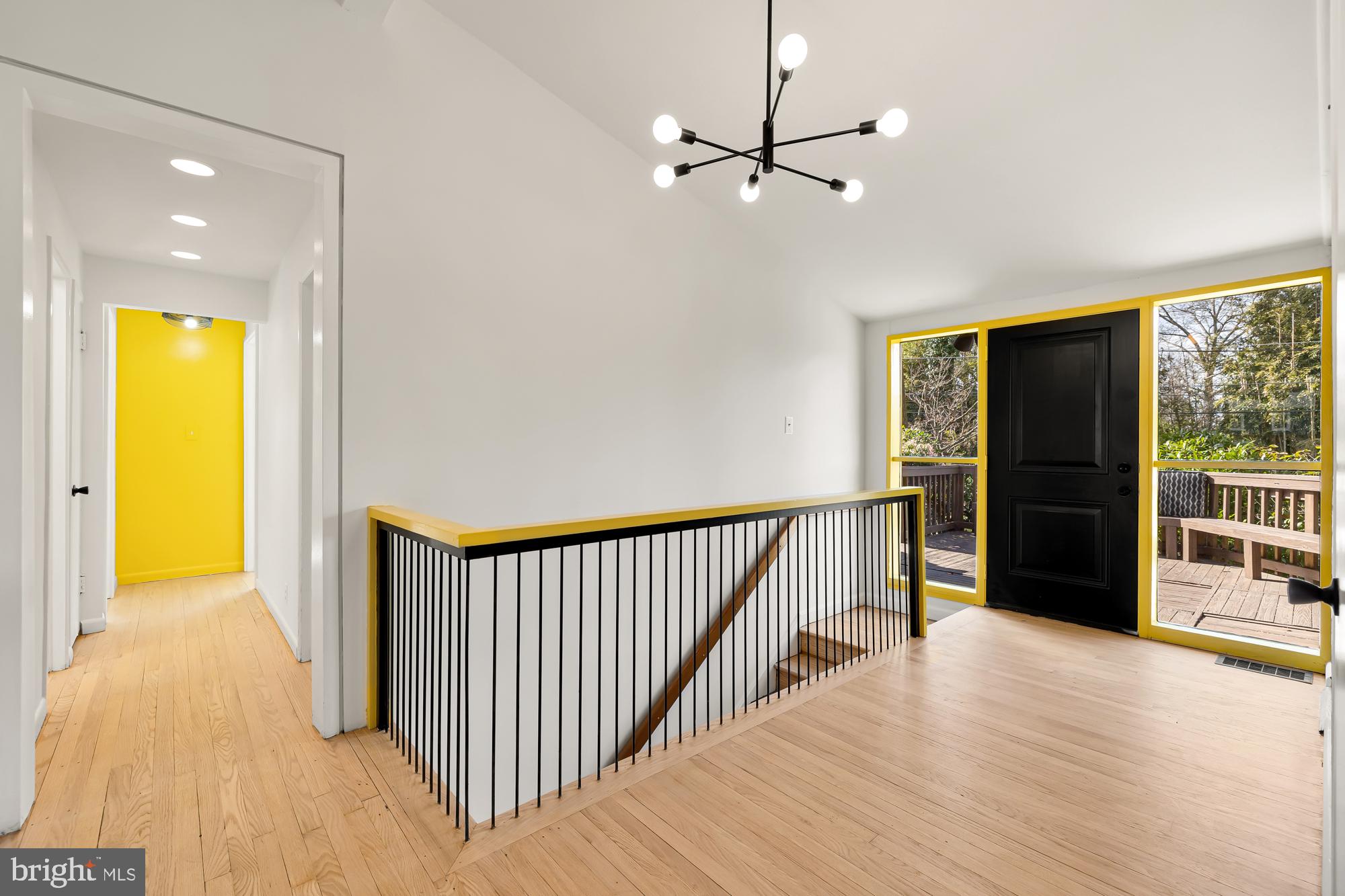 11500 Regnid Drive Silver Spring, MD 20902 - Photo 22 of 50 a view of a hallway with wooden floor and chandelier