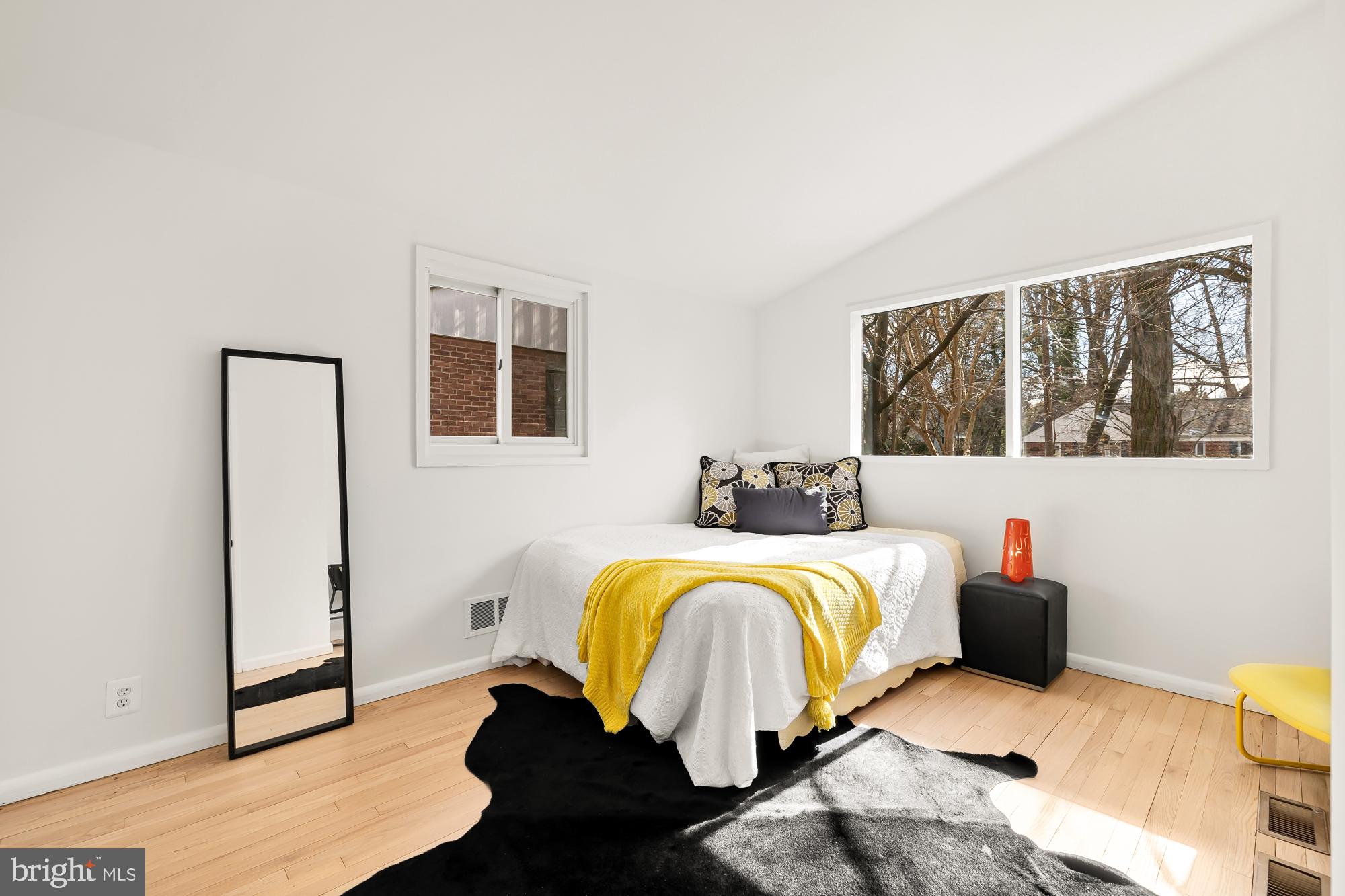 11500 Regnid Drive Silver Spring, MD 20902 - Photo 24 of 50 a bedroom with a bed and wooden floor