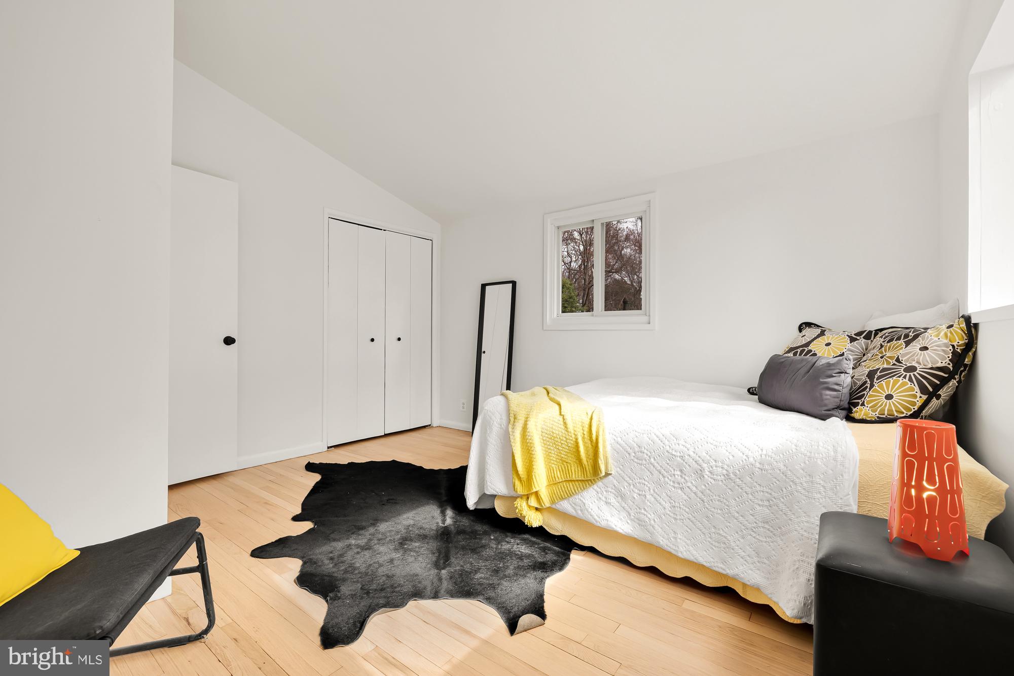 11500 Regnid Drive Silver Spring, MD 20902 - Photo 26 of 50 a bedroom with a bed and wooden floor